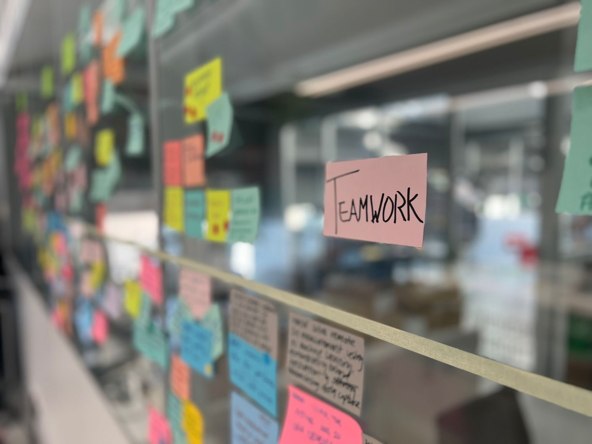 Teamwork Sticky Note on a Glass Background